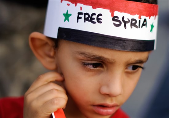 [Protesters in Syria. Image from pulsemedia.org.]