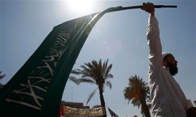 [Islamist raising a flag in Alexandria. Image from unknown archive.]