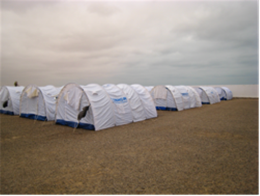 [Image Source: Noureddine Jebnoun. United Nations High Commissioner for Refugees (UNHCR) tents at a camp in Ras Ajdir, Tunisia]