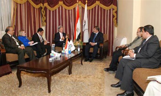 [John Kerry and Anne Patterson visit Muslim Brotherhood`s Freedom and Justice Party headquarters. Image from ikhwanonline.com]