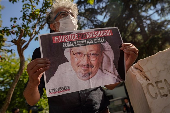 People hold pictures of Jamal Khashoggi during an event marking two-year anniversary of the assassination of Saudi dissident journalist Jamal Khashoggi at the Saudi Consulate in Istanbul, 02 10.2020 via Shutterstock