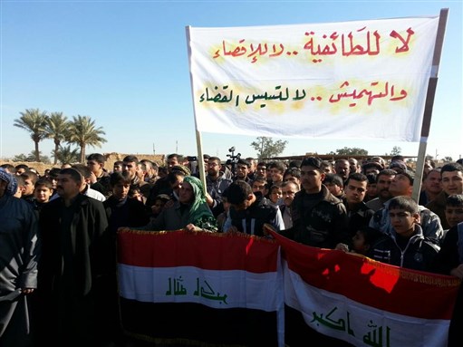 [Iraqis in the Northern province of Salah al Deen on 11 January 2013 holding a banner that reads \"No to Sectarianism…exclusion, marginalization and the politicization of the judiciary.\" Image from the “Great Iraqi Revolution” Facebook page.]