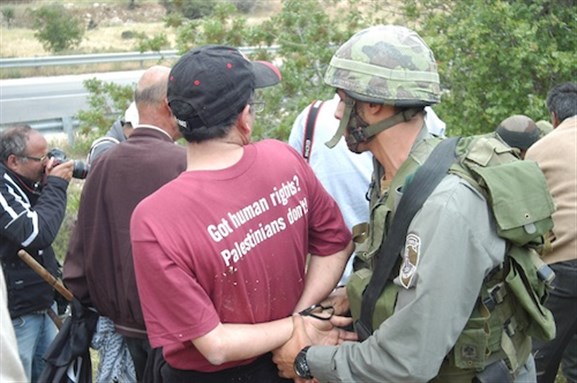 [Mazin Qumsiyeh being arrested by Israeli military in al-Walaja village on May 15, 2011. Image from imemc.org]