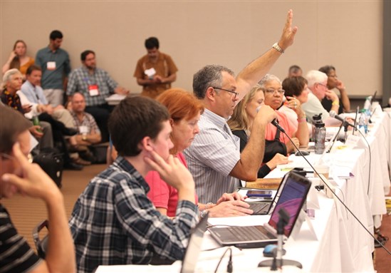 [Members of the GA 220 Middle East Peacemaking Issues Committee in session on Monday. Image by Danny Bolin.]