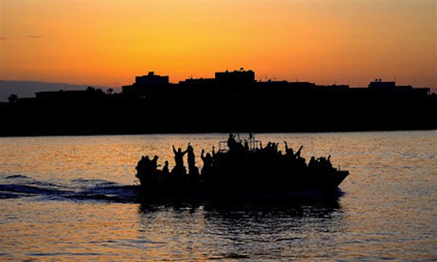 [Tunisian migrants arriving at Lampedusa. Image by Filippo Monteforte/AFP/Getty Images]