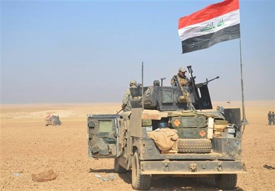 [Iraqi army tank and personnel outside Mosul during an offensive to retake the city from ISIS. Image from Tasnim News]