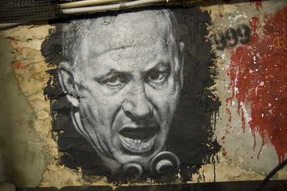 [Graffiti image of Benjamin Netanyahu. Image by Abode of Chaos/Flickr.]