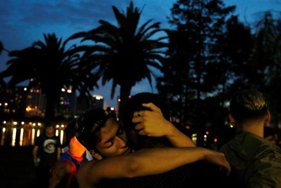 [Vigil in Orlando commemorating victims of Pulse Mass Shooting. 