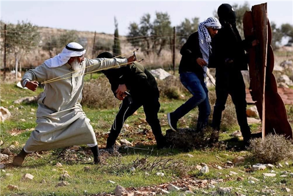 Palestinian protestors clash with Israeli occupation forces in the village of Deir Jarir in the occupied West Bank via Quds News Network