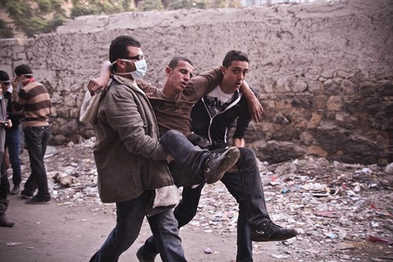 [Protester injured during clashes with security forces on Mohamed Mahmoud Street on 20 November 2012. Photo by Shadi Rahimi]