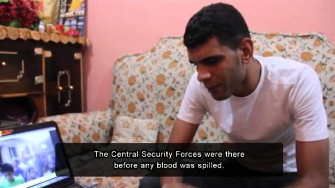 [Eyewitness and videographer Hazem Barakat describing the attack on Shi`a in Giza. Image from Mosireen]