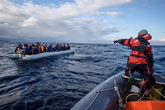 [Image of MSF staff, Sami, in the conversation during a rescue. Image by Greenpeace volunteer Will Rose]