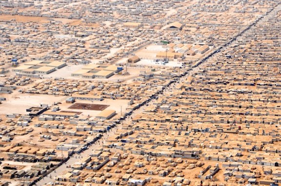 [A close-up view of the Za`atri camp for Syrian refugees as seen on July 18, 2013, from a helicopter carrying U.S. Secretary of State John Kerry and Jordanian Foreign Minister Nasser Judeh. Image by US Department of State/Flickr.]
