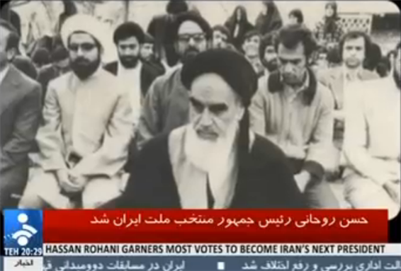 [Screenshot from Iranian TV showing a young Rouhani with Ayatollah Khomeini.]