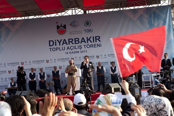 [Thousands gathered in Diyarbakir to hear Iraqi Kurdish leader Masoud Barzani and Turkish Prime Minister Recep Tayyip Erdogan speak, opening a day of ceremonies including a performance by Kurdish poet and singer Sivan Perwer. Image by Serpil Polat / Nar Photos.]