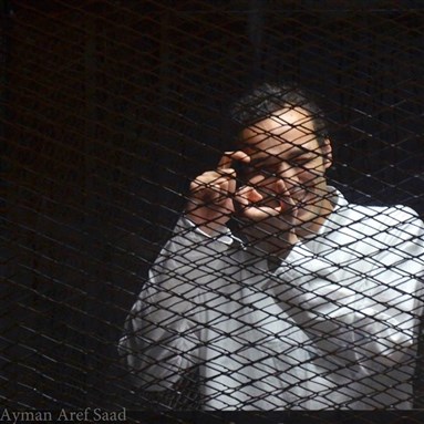 [Photojournalist Mahmoud Abu Zeid, known as Shawkan, who has been detained for over three years pending trial. Photo from the Freedom for Shawkan Facebook page.] 