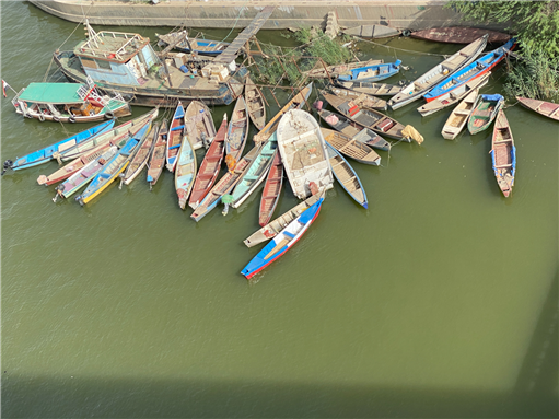 Boats in the river of Basra. Photo by Mohammed_Al_Ali via Shutterstock.