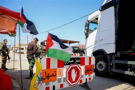 A roadblock checking for COVID-19 in Qalqilya, Palestinian Territories, Palestine (14 April 2020). Photo by abu adel - photo via Shutterstock.