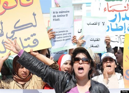 [Fouzia Assouli, President of Morocco`s Democratic League for Women`s Rights, and 300 protesters stage a sit-in outside the local court in Larache that approved the marriage between Amina Filali and her rapist before she committed suicide. Image from Getty.]