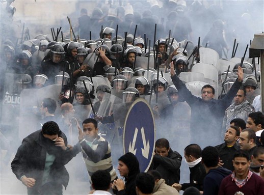 [Egyptian Police and Protesters in Cairo, January 2011. Image from Unknown Achive]