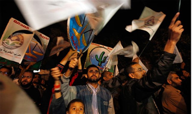 [Supporters of Egypt`s Muslim Brotherhood `The Freedom and Justice Party` participate in a march in support of the party ahead of parliamentary elections, in Cairo. Image from Reuters]