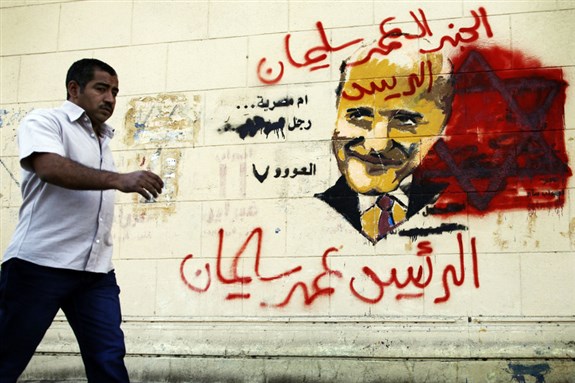 [Anti-Omar Suleiman posters in the streets of Cairo. Image from Demotix.com]