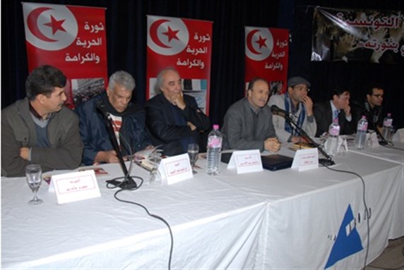 [From left to right: Samir Sassi, Ibrahim Abdelmajid, Wasini al-A’raj, Mehdi Mabrouk, Kamel Zoghbani, Francesco Leggio, and Kamel Riahi. Image from Agence Tunis Afrique Presse.]