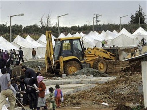 [Syrian refugees at Reyhanli refugee camp in Antakya, Turkey. Image by Syria Freedom via Flickr] 