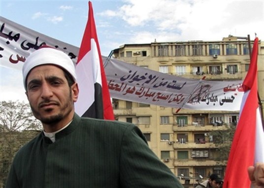 [An imam in Tahrir Square during the 2011 Egyptian protests. Image by Sherif9282 via Wikimedia Commons]