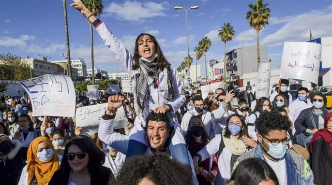 Tunisian doctors demonstrate in the capital Tunis over the country's crumbling public health infrastructure, following the death of a young doctor in a lift accident via AFP