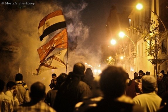 [Ultras flags appearing at the site of clashes between protesters and security forces near the Ministry of Interior. Photo by Mostafa Sheshtawy]