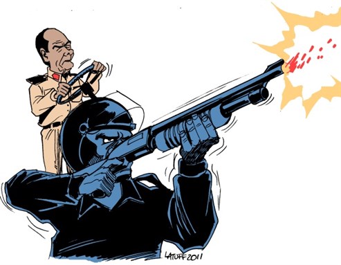 [Cartoon by Carlos Latuff]