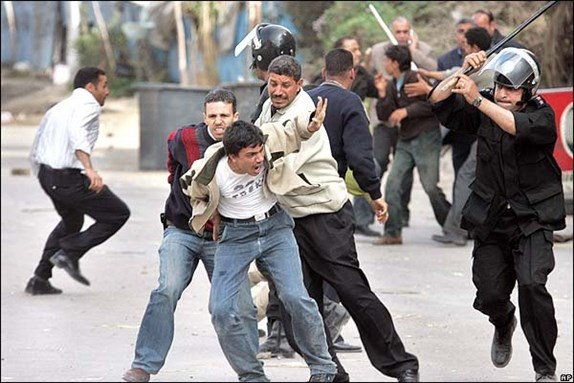 [Police arresting an activist in an election rally. Image from unknown archive]
