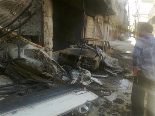 [Destruction in Yarmouk Palestinian Camp in Damascus. 26 July 2012. Photograph by Basem Sabbagh.]