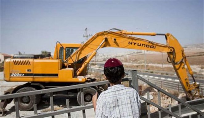 [A young settler views construction. Image from Associated Press.]